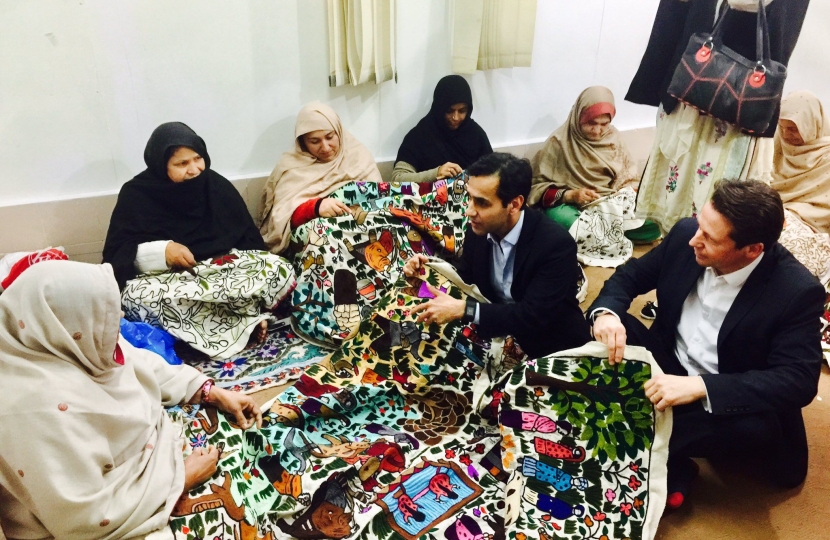 Nigel and Rehman Chishti meeting women at a refugee camp in Kashmir