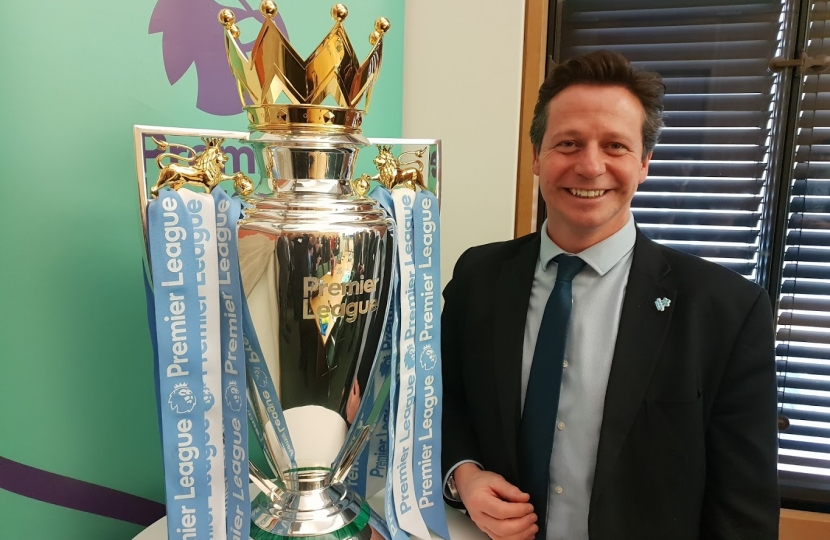 Nigel Huddleston MP with the Premier League Trophy