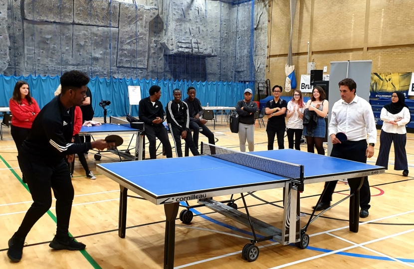 Johnny Mercer MP playing ping pong