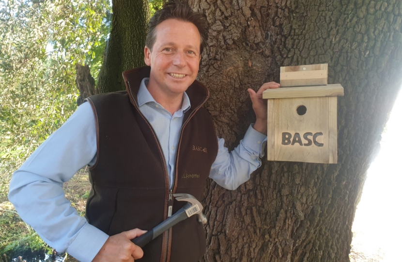 Nigel putting up bird box