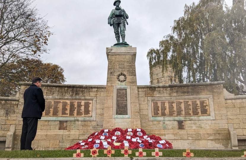 Nigel Huddleston MP pays respects at the War Memorial in Evesham.