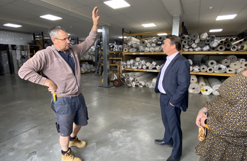 Nigel Huddleston MP viewing a business based in Squab Storage Evesham.