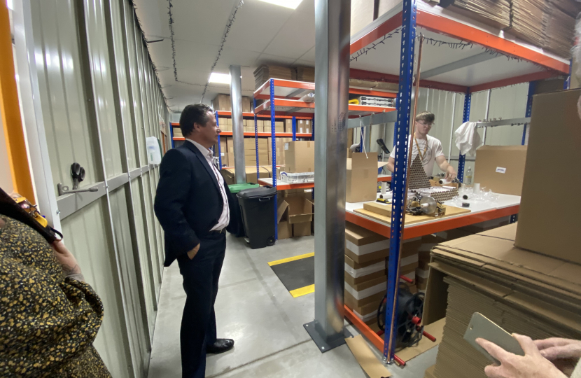 Nigel Huddleston MP viewing a business based in Squab Storage Evesham.