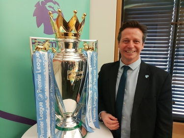 Nigel Huddleston MP with the Premier League Trophy