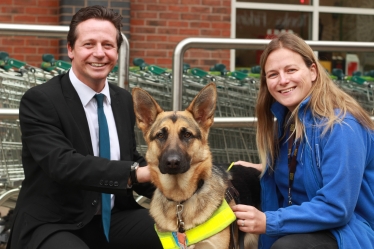 Nigel Huddleston MP with Guide Dog Nushka and trainer