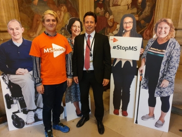 Nigel with cut outs of MS sufferers at the MS Parliament drop-in