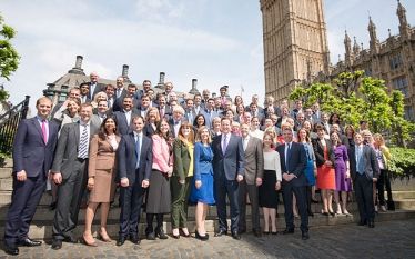 Nigel Huddleston and new MPs outside Parliament