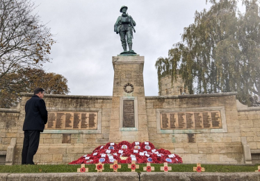 Nigel Huddleston MP pays respects at the War Memorial in Evesham.