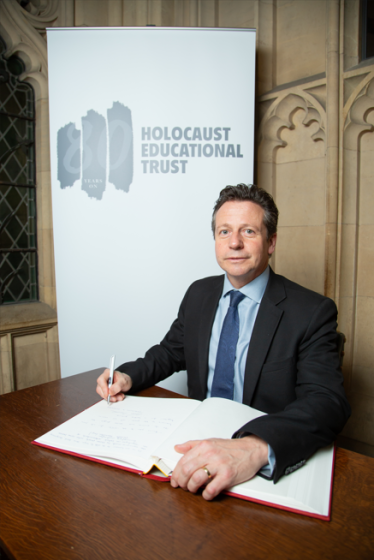 Nigel signing the Holocaust Educational Trust’s Book of Commitment