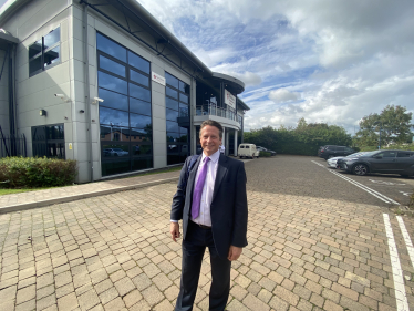 Nigel Huddleston MP outside Karndean Designflooring in Evesham.